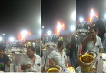 পিছনে দাউদাউ করে জ্বলছে বিয়ের প্যান্ডেল, নিশ্চিন্তে মাটন কারি-তন্দুরি রুটির খেয়ে যাচ্ছেন নিমন্ত্রিত