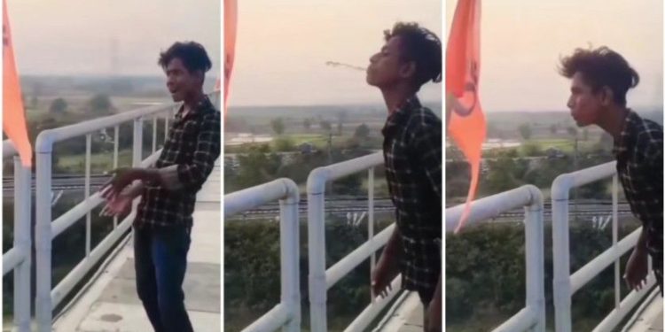 “ওঁ” লেখা গেরুয়া পতাকায় এক যুবকের থুতু দেওয়ার ভিডিও পোস্ট করে নিন্দায় সরব হলেন শুভেন্দু অধিকারী